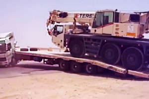 Failed loading and unloading of heavy equipment. Falling from a trailer of heavy equipment.