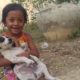 The animals Wildlife,The girl play with withe and black (small dog),