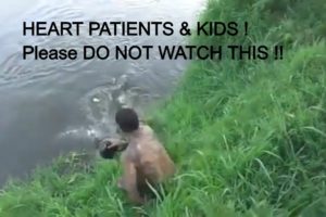 CROCODILE ATTACKS ON PEOPLE CAUGHT ON CAMERA! CROCODILE  drags MAN from river bank into the water!