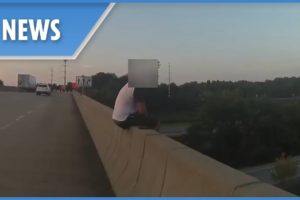 Cop prevents man from jumping off a bridge