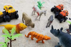 Jerry playing with cars and animals, animal fighting with cars