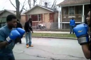 Hood fight with boxing gloves.