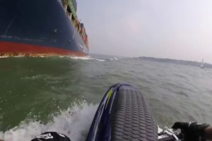 Jet ski rider nearly dies touching a cargo ship