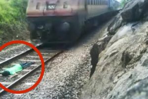 India train stunt: Man risks life lying on railway tracks as train speeds over him