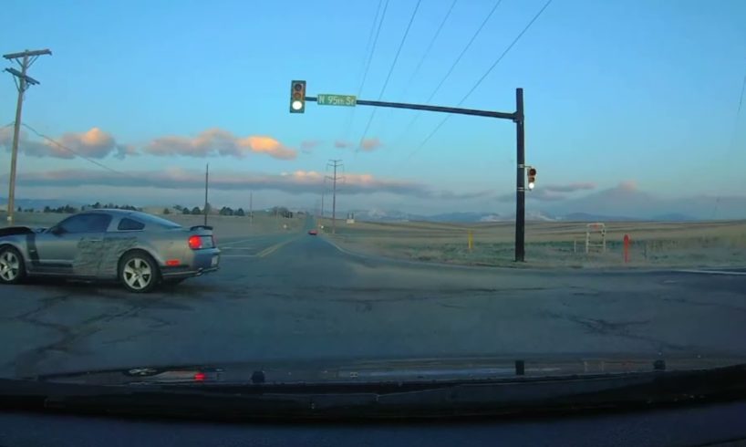 Idiot driver at the intersection, caught on Dashcam