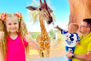 Diana and Roma feed the animals at the Emirates Park Zoo