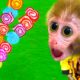 Smart Monkey Baby Bi Bon rescues Cheese from an aggressive crocodile and eats colorful marshmallows