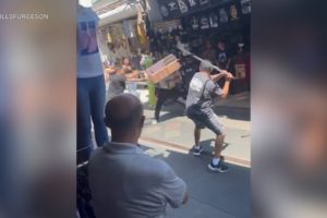 Video: Fists fly, men fight with crutches during chaotic brawl in LA's Fashion District | ABC7