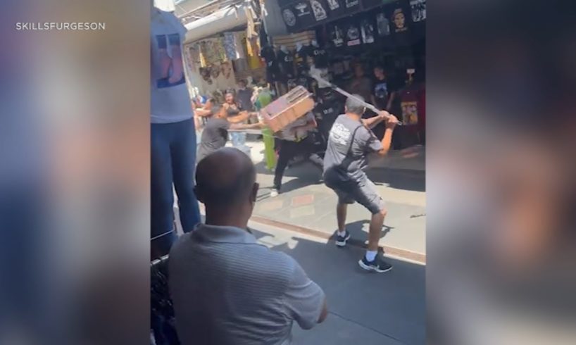 Video: Fists fly, men fight with crutches during chaotic brawl in LA's Fashion District | ABC7
