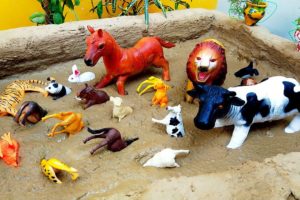Plastic Toy Wild Animals Stuck in Mud | Cow Elephant Rooster Lion in Dino Land Mud Ground