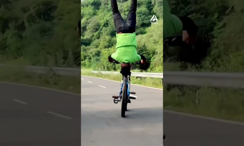 Man Does Headstand While Riding Bike | People Are Awesome #shorts