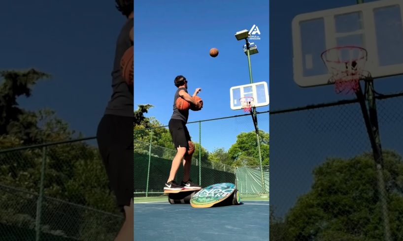 Guy Balances on 2 Roller Boards While Shooting Basketballs | People Are Awesome
