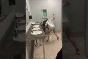 2 girls fighting in the bathroom