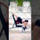 Person Performs Intense Contortion Trick On Outdoor Workout Bench