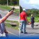 Shocking moment motorist shoots dead two environmental protesters blocking a road