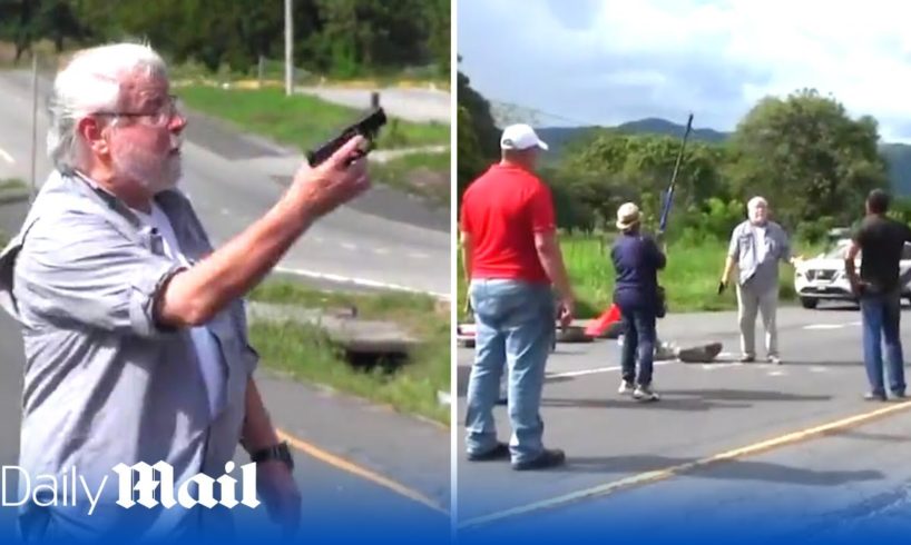 Shocking moment motorist shoots dead two environmental protesters blocking a road