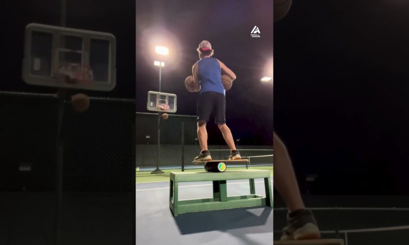 Guy Lands Basketballs Into Hoop While Standing on Balance Board
