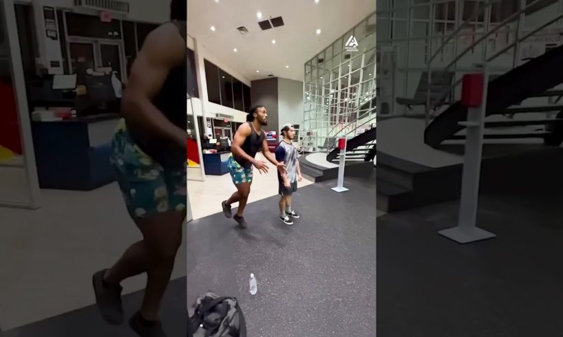 Man Jumps Over Two Guys at Gym