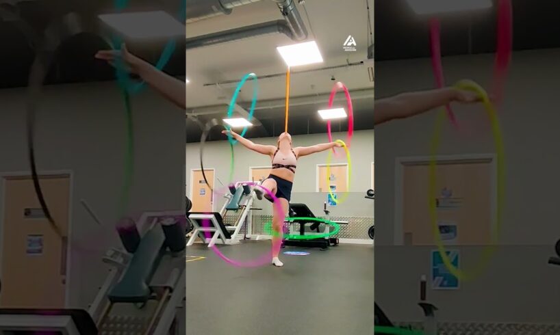Woman Performs With Multiple Hula Hoops