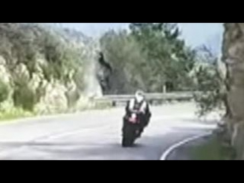 Motorcycle flips over cliff in scary crash caught on tape