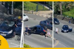 Moment fight breaks out between motorists on main road