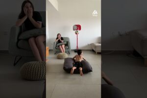 Boy Chilling Indoors Casually Flicks Ball into Basket Without Looking