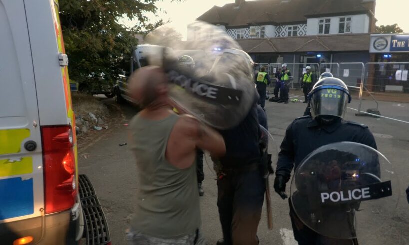 “You knocked my fu**ing teeth out!” Moment riot police smash shield into man's face in Epping clash