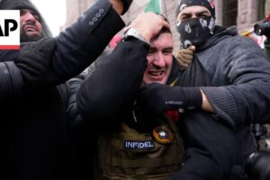 Counterprotesters force pardoned Jan. 6 rioter Jake Lang to leave rally in Minneapolis