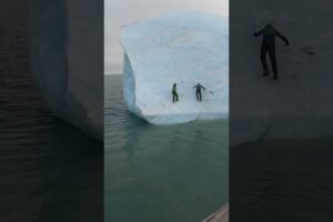 This huge iceberg flipped on these two guys! 😮🤯  -  🎥 Viralhog
