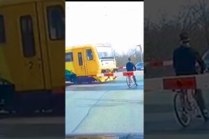 CRAZY CYCLIST VS TRAIN!